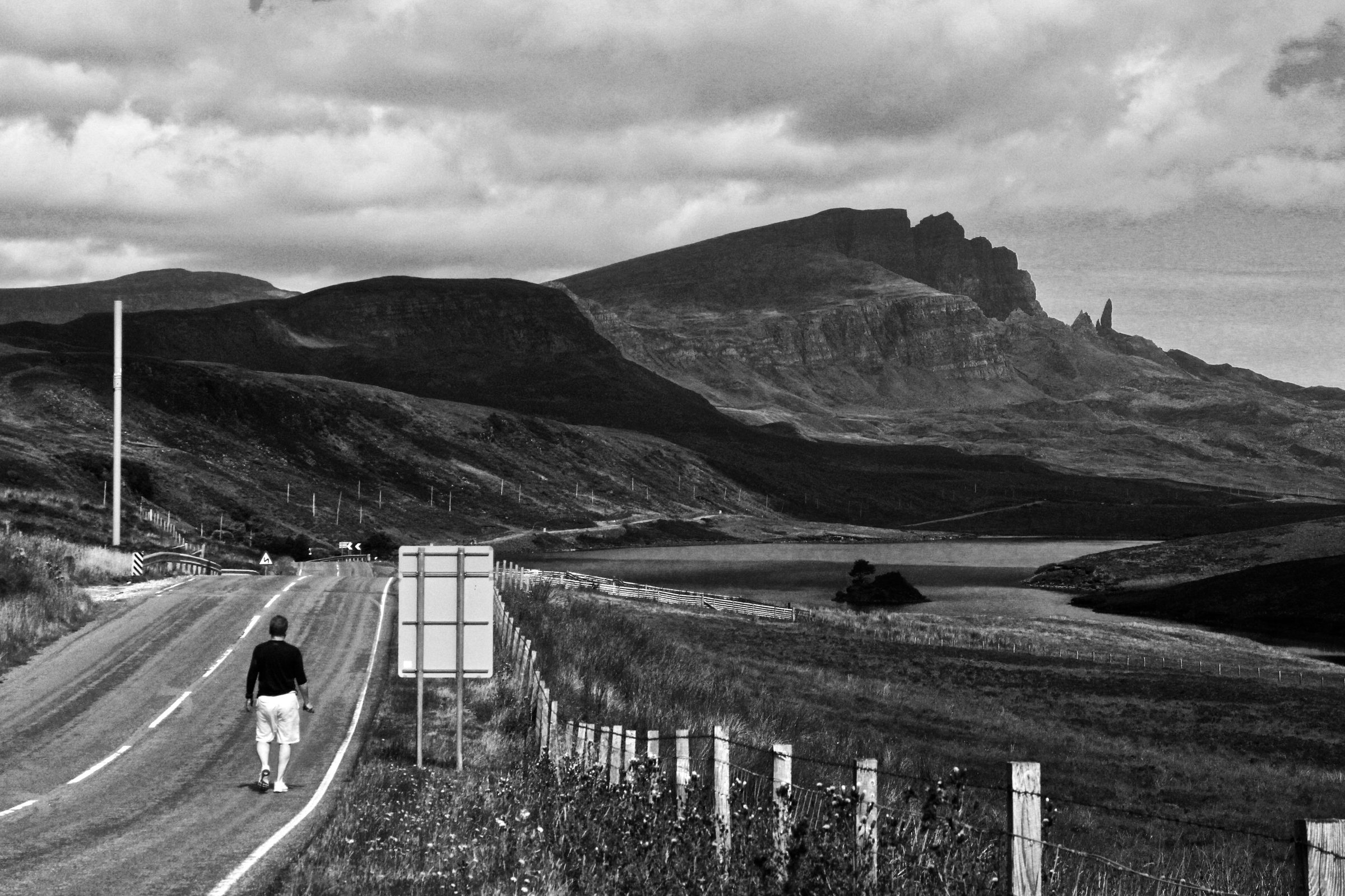 A figure walking toward the Old Man of Storr, Isle of Skye