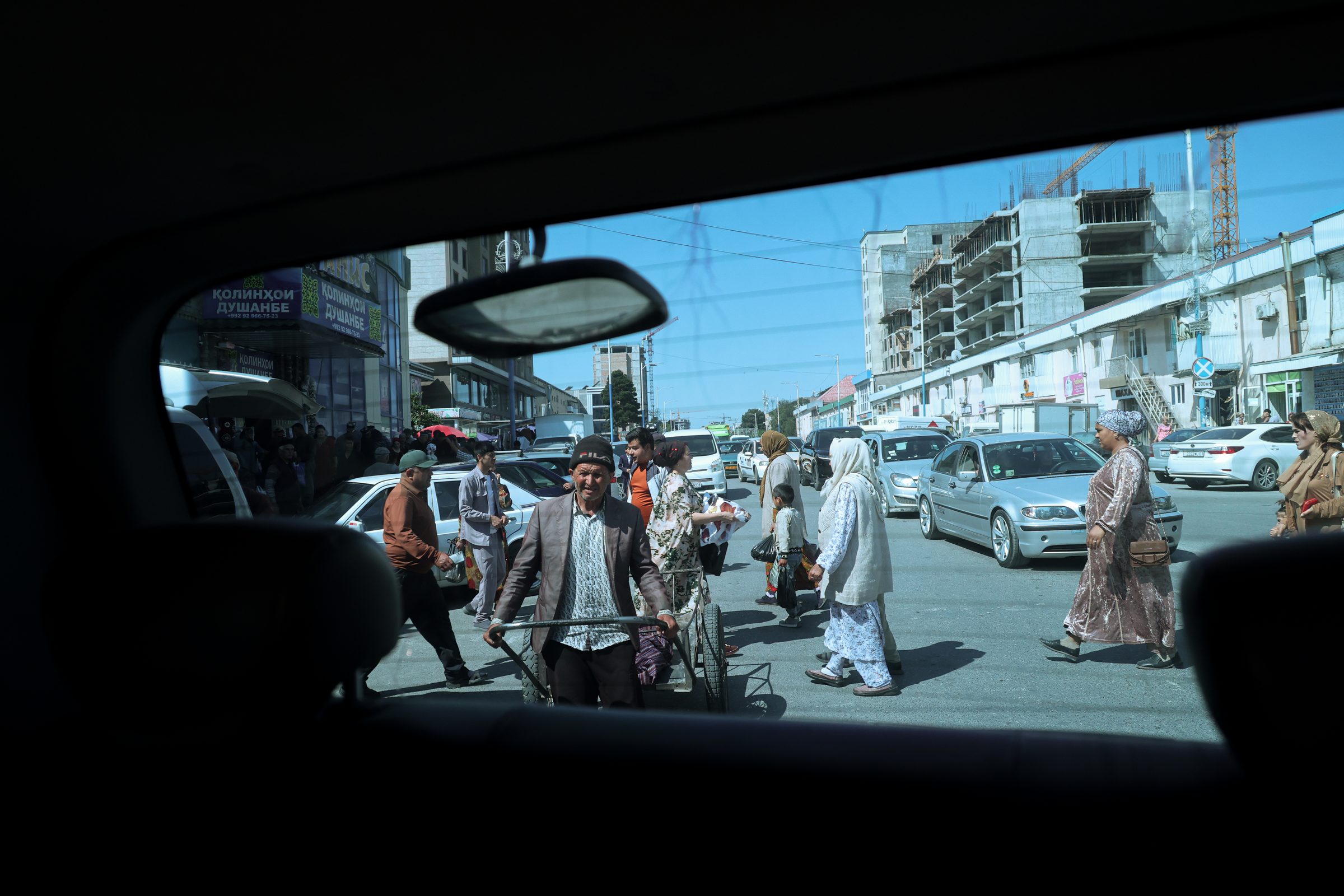 A busy street seen through a car window, Panjkent