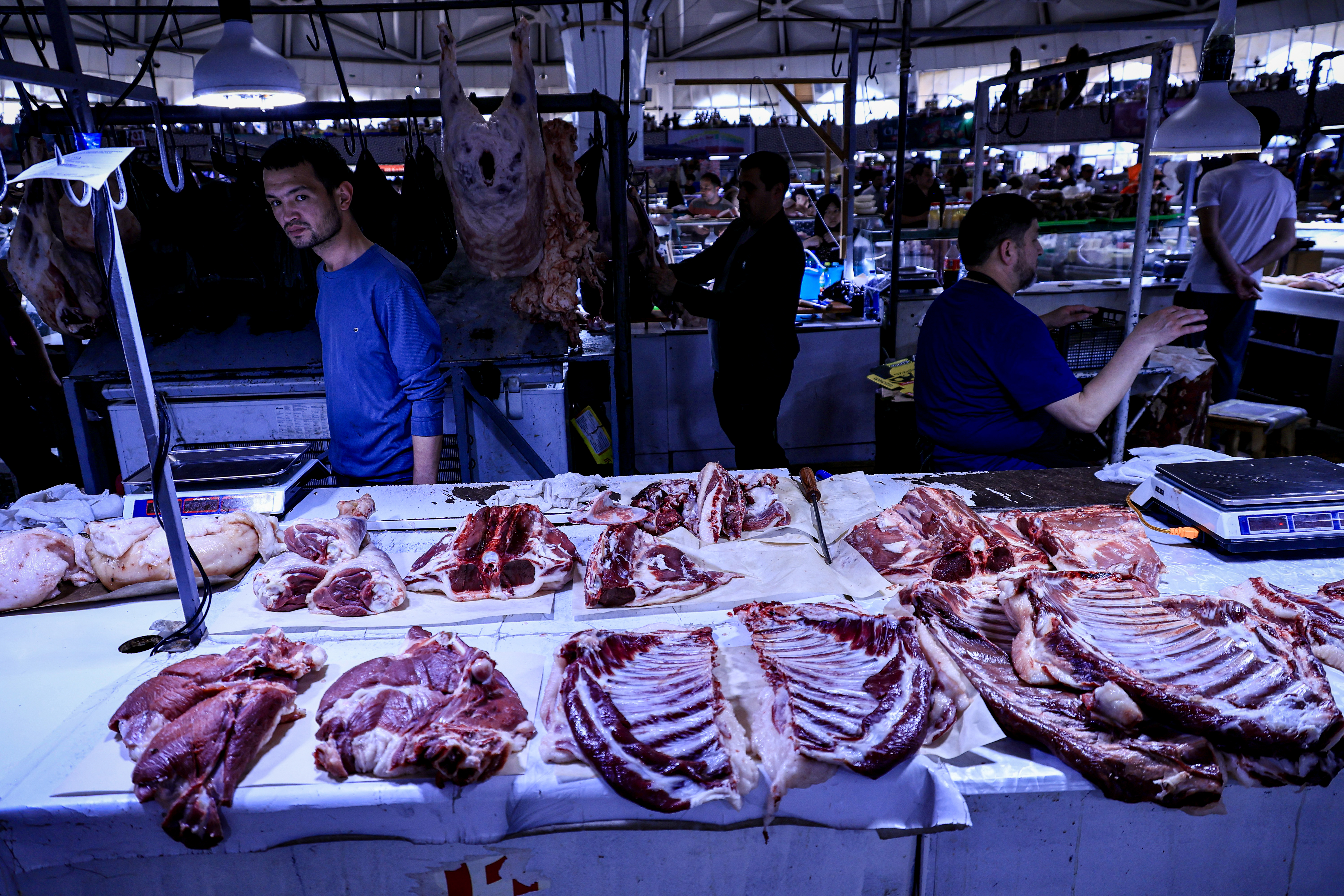 Butcher sells cuts of meat in Chorsu Baazar, Tashkent